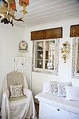 Country-style living room with white wooden furniture and antique clock