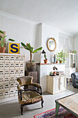 Room with antique furniture, plants and decorative objects