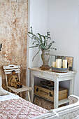 Nostalgic room corner with vintage furniture, eucalyptus bouquet and decorative elements