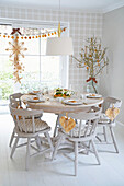 Dining table setting and Christmas decorations made from dried orange slices