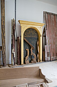 Antique wooden doors and ornaments in a restoration workshop