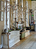 Decoration with birch branches and pendants in a rustic hallway