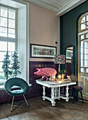 Vintage-style seating area with pink porcelain pig