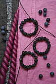 Small sloe berry wreaths to decorate presents, fabric dyed in sloe decoction