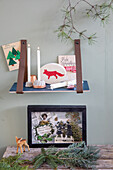 Christmas wall shelf with candles, cards and decorative elements
