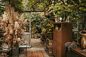 Garden shed with plants and vintage furniture
