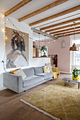 Scandinavian-style living room with grey sofa and fairy lights