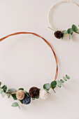 Minimalist DIY wreaths with eucalyptus and pompoms