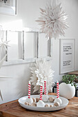 Christmas table decoration with DIY Advent wreath and white paper stars