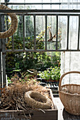 Wicker basket, wreaths and dried flowers