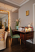 Workplace with vintage desk and festive decorations in the living room