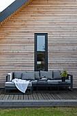 Outdoor seating area on a modern wooden terrace