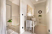 Bright hallway with bench, mural and decoration in natural colours