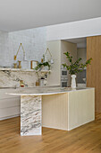 Modern kitchen with marble worktops in the open-plan living area