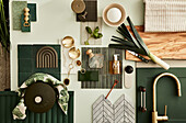 Moodboard for kitchen decor in green and brass, wooden chopping board with knife and leek