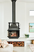 Modern fireplace with wood storage in minimalist living room