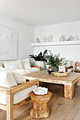 Bright living room with wooden furniture and indoor plants