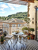 Cosy balcony with seating, mosaic tiles and views of the Mediterranean landscape