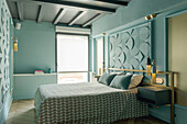 Bedroom in pastel blue with 3D wall panels