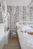 Bedroom with birch forest wallpaper and Scandinavian design
