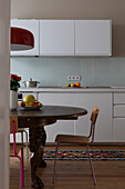Rustic dining table in white kitchen