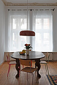 Rustic dining table with fruit bowl and bouquet of flowers