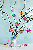 DIY cardboard flowers made from toilet rolls as colourful spring decorations
