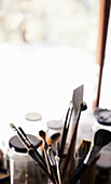 Brushes and painting utensils in an artist's studio