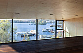Large panoramic window with a view of the lake and jetty