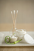Natural care creams, cotton buds, cotton pads
