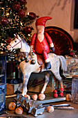 Vintage Christmas decoration with wooden Father Christmas figure on toy horse