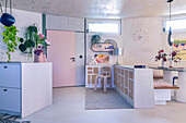 Kitchen and dining area in pastel colours and geometric design