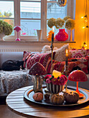 Colourfully decorated living room with autumn accents and candlelight