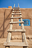 Wooden Ladder Against an Adobe Building, Taos, New Mexico, USA