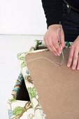 Making an upholstered stool (attaching an upholstery button)