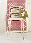 Scarf and bag hanging on chair