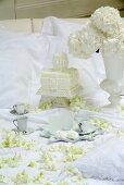 A white wedding cake and coffee cups