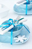 A festive place setting with a snow flake