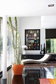 A designer living room with black floor tiles