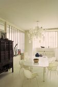 Dining room in a white loft and Asian style antique cupboard
