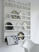 Plates in a white plate rack