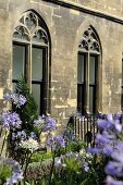 Flowers in front of a church facade with Gothic windows