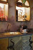 Metal sink in rustic kitchen