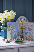 Easter cards and chocolate Easter eggs on a table