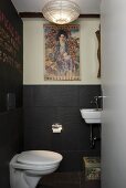 A designer toilet with grey slate wall tiles