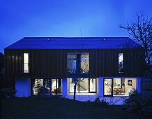 A newly built house illuminated during the evening