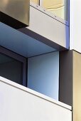 Detail of a facade with a balcony in a contemporary apartment block