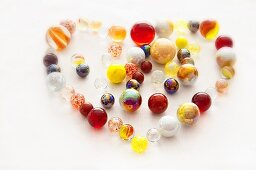 Colourful glass marbles shaped like a heart