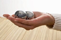 Qi Gong balls in a woman’s hand