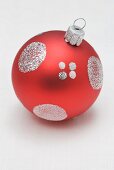 Red Christmas bauble with silver decoration